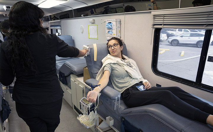 Alanna Garza waits her turn to donate blood. This was the second time this semester the College hosted an on-campus blood drive.