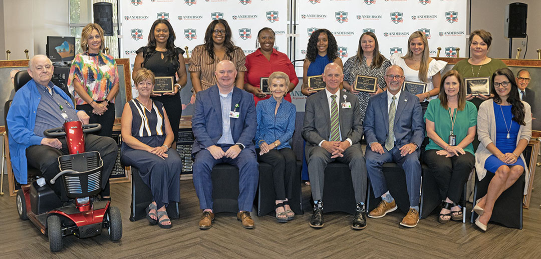 During a luncheon celebrating the MCC Associate Degree Nursing scholarship recipients are seated from left Dr. Joe Anderson, Joanna Barney, Dr. Wes Garrison, Jan Hollingworth Farrington, John Anderson, Dr. Tom Huebner, Dr. Lara Collum, and Dr. Leia Hill. Standing back from left are Trinity Farr, Robin Garner, Letasha Naylor, Marquita Brewster, Tiara Pace, Rachel McCollough, Amber Fant, and Ashley Hollman. 