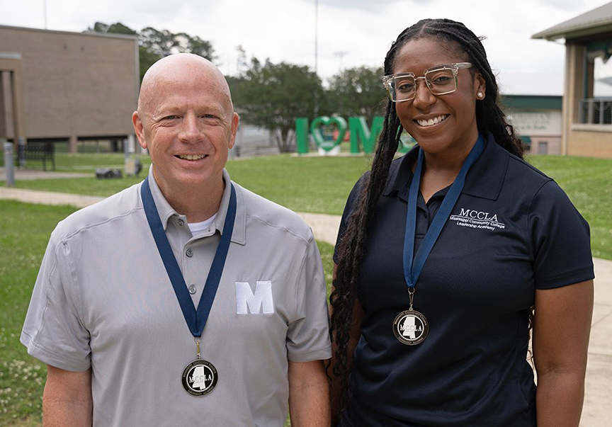 MCC employees Darren Bane and Jawanda Huggins pose together for a photo on campus.