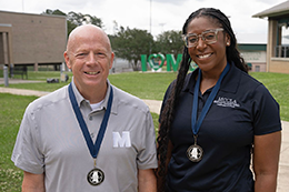 MCC employees Darren Bane and JaWanda Huggins pose together on campus for a photo. 