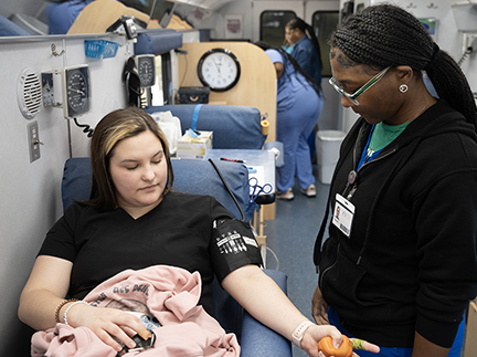 MCC student Brooklyn Mowdy, left, relaxes as Feren Foster, Mississippi Blood Services donor technician II, begins the donation procedure. MCC hosted a two-day blood drive on campus. 