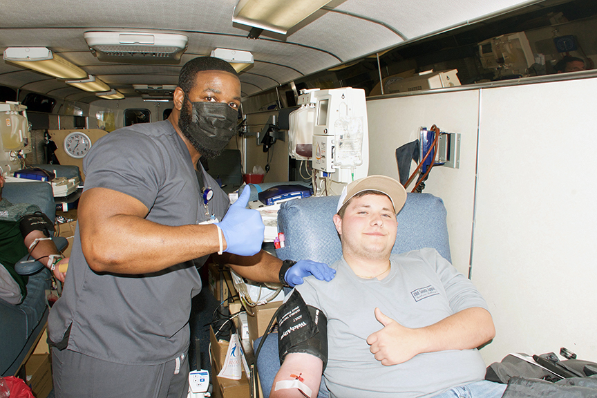 Freshman Christopher Ray Brooks, right, and Mississippi Blood Services Donor Specialist Houston Sherrod give a thumbs up during Brook’s donation session. Brooks was one the many MCC students, faculty and staff and community residents who participated in the campus blood drive. 