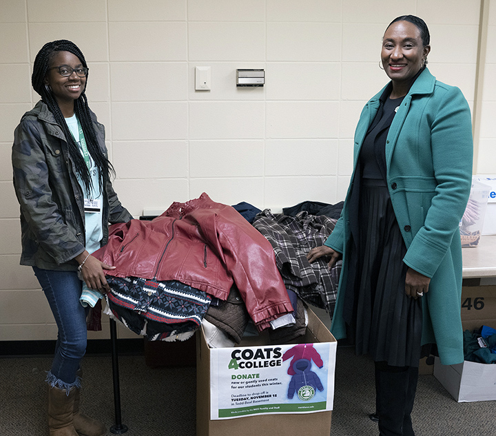 Lashundra Grady, support services coordinator, left, and Dawn Wright, psychology instructor, gather the collection from Coats 4 College. The College’s Social Science Division was instrumental in the Coats 4 College drive. 