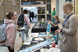 Students and community resource personnel meet during the College's Resource Fair