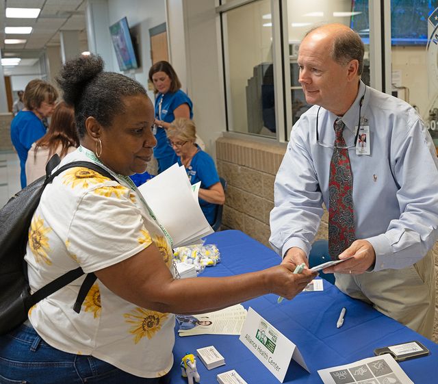 MCC student Lisa Keys meets Ray Gullette, business development representative with Alliance Health Center during the College’s Community Resource Fair. More than 30 vendors participated in the event. 