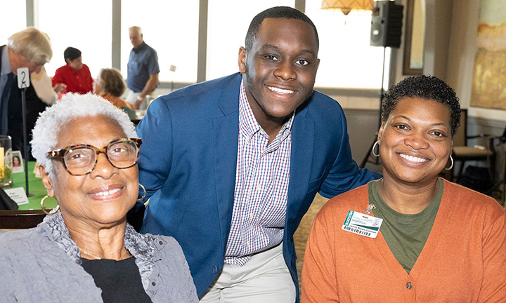 Donors Gloria Brown, left, and Jamila Brown Coleman, right, meet MCC student and scholarship recipient Patrick Martin. 