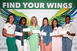 Faculty and Staff members pose with awards.