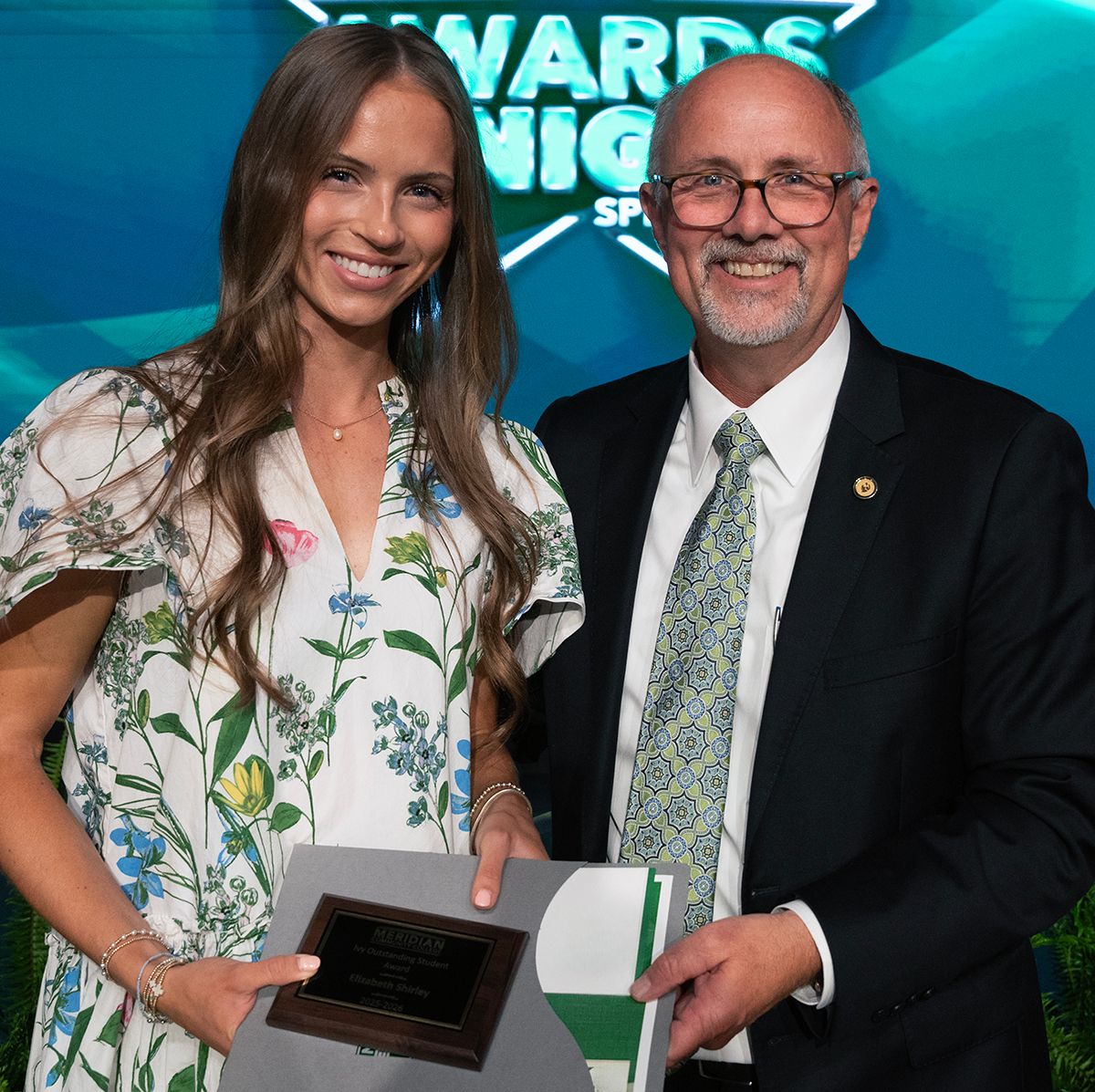 Elizabeth Shirley, left, is presented the Ivy-Scaggs Distinguished Student Award by MCC President Dr. Tom Huebner during the conclusion of the first Awards Night ceremony. 