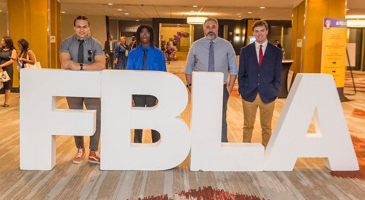 Gathered at the national conference are Sabien Lyons, left, SeDarrick Davis, Anthony D’Angelo, MCC FBLA advisor, and Cole Milling. Not pictured is Justin Pugh. 