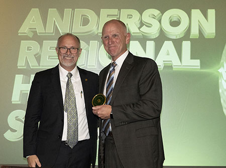 MCC President Dr. Tom Huebner congratulates John Anderson, president and CEO of Anderson Regional Health System. The system was recognized during the Lifetime Giving Awards presentation as the newest member of the Emerald Circle. 