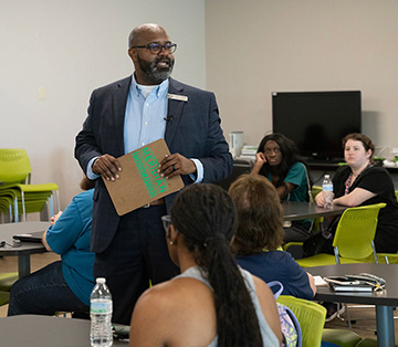 Dr. Cedric Gathings speaks to audience members at LEAD session.