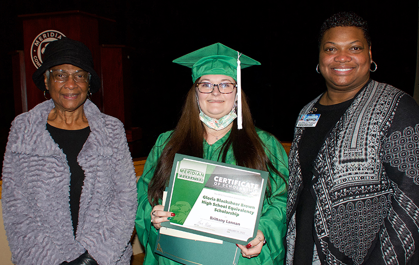 Gloria Blackshear Brown, left, and Jamila Brown Coleman, right, congratulate Brittany Lannan as the Gloria Blackshear Brown High School Equivalency Scholarship recipient. The scholarship was presented during MCC’s HSE commencement. Coleman, the lead instructor in the College’s Adult Education Department, is Brown’s daughter.