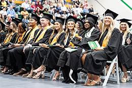 Graduates sit during commencement ceremony in Graham Gymnasium. 