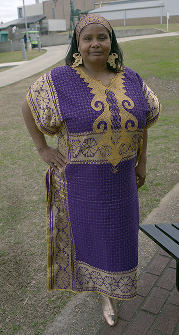 Lolita O’Neal pauses for a photograph wearing her civil rights activist grandmother’s dress. O’Neal is a student in the College’s Medical Office Management Program. 