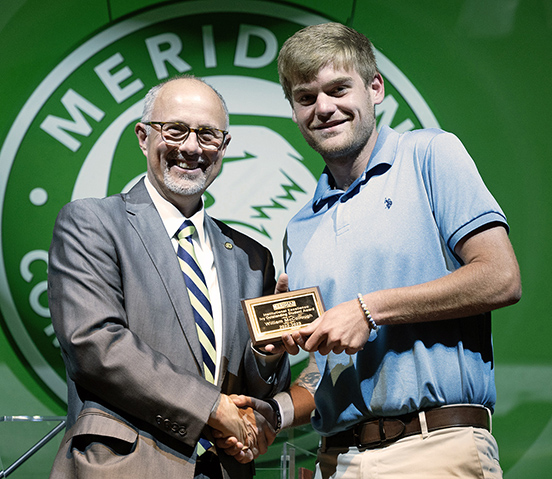 MCC President Dr. Tom Huebner, left, congratulates William McCullough as the Ivy Outstanding Student Award recipient. McCullough and other MCC students were celebrated for their outstanding achievements during two Awards Night ceremonies. 