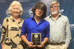 Nelson Kimbrough, center, with his grandmother and dad, after the Mississippi Association of Adult and Community Education (MAACE) Organization's Students of the Year Award presentation. 