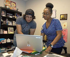 Nelson Kimbrough reviews paperwork with Rhonda Smith, who is the MCC Adult Education College and Career Navigator. Kimbrough is one of five recipients of the Mississippi Association of Adult and Community Education (MAACE) Organization's Students of the Year Award. 