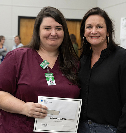 MCC Associate Degree Nursing Student Lauren Lewis, left, receives the Mississippi Nurses Foundation Scholarship from Amanda Crawford, the foundation's executive director. 