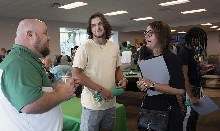 Brandon Dewease, left, meets with Liftoff participants. The next session is Thursday, Aug. 4.