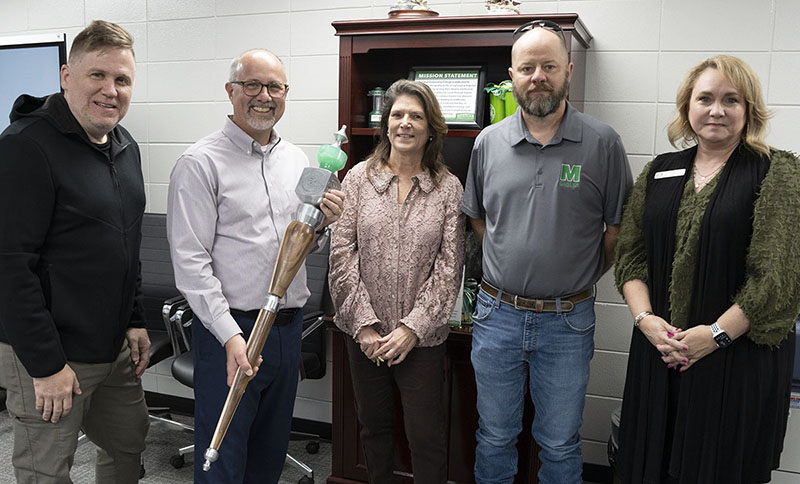 Presenting the new mace to Dr. Tom Huebner are, from left, Daniel Ethridge, Dr. Huebner, Terrell-Nicholson Taylor, Brian Warren and Lori Smith. 