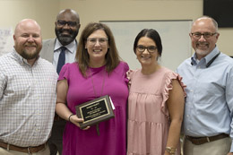 Mandy Hurtt, third from left, is joined by Brandon Dewease, left, Dr. Cedric Gathings, Leia Hill and Dr. Tom Huebner after the announcement of Hurtt being named MCCer of the Month.