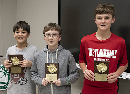 Seventh-grade winners are from left Eli Ip, first; Dylan Null, second; and Cord Wilkerson, third. 