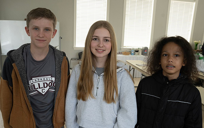 Seventh-grade winners are from left: Asher Ivey, first; Madison McRee, second; and George Jones, third. 
