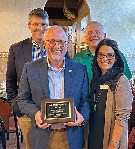 At the celebration for MCCer of the Month are Michael Thompson, Dr. Tom Huebner, Joseph Knight, and Dr. Leia Hill. 