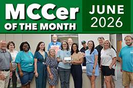 Kay Thomas poses for a photo with her coworkers at the MCCer of the Month award presentation.