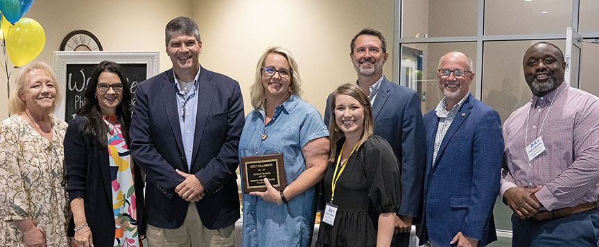 Gathering at the MCCer of the Month announcement are Tonya Crenshaw, left, Dr. Leia Hill, Michael Thompson, Kristi Williamson, Phyllis Holladay, Dr. Chad Graham, Dr. Tom Huebner, and Dr. Tommy Winston. 