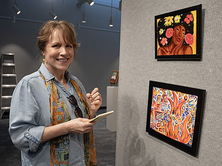 Juror Gail Morton takes a closer look at Meridian Community College art students’ works in evaluating the Student Annual Exhibition and Competition. The show opens on the MCC campus April 16. 