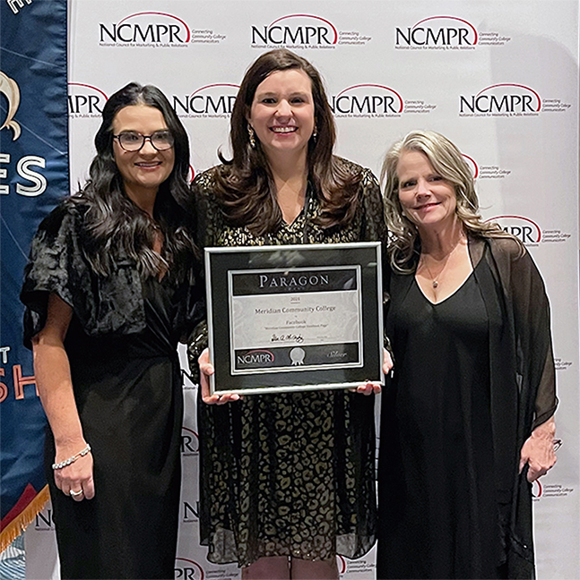 Leia Hill, left, Lauren Pratt, and Amy Miller with the National Council for Marketing and Public Relations Paragon Award.