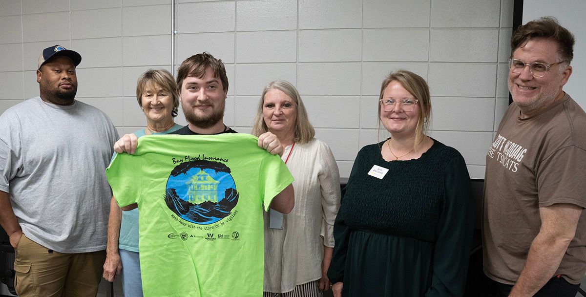 Lauderdale County’s Program for Public Information Committee members Justin Jordan, back left, Mary Ruth Sharp, Cathy Loomis, and JoJo Haygood, with Gage Pendergrass, MCC Graphic Design Technology Program student and Daniel Ethridge, MCC Graphic Design Technology Program coordinator and instructor. Pendergrass created the winning design in the committee’s contest. Lauderdale County’s Program for Public Information Committee members Justin Jordan, back left, Mary Ruth Sharp, Cathy Loomis, and JoJo Haygood, with Gage Pendergrass, MCC Graphic Design Technology Program student and Daniel Ethridge, MCC Graphic Design Technology Program coordinator and instructor. Pendergrass created the winning design in the committee’s contest.