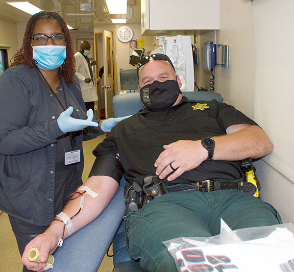 Mississippi Blood Services Specialist Tammy Addison assists Ruston Russell during the first day of the two-day blood drive hosted by MCC Campus Life department. 