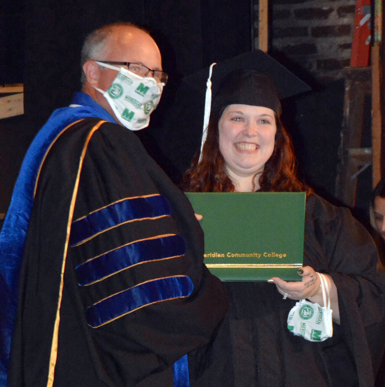 MCC President Dr. Thomas Huebner poses with Christy Roberts during the College’s graduation ceremony. Roberts was one of nearly 100 students who participated in the MCC Summer Commencement held in the Temple Theater. 