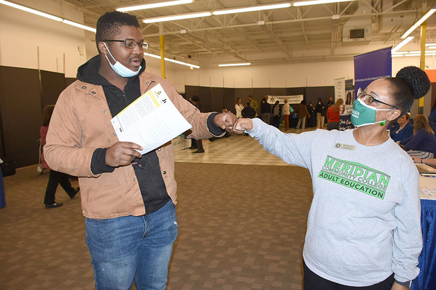 Damarcus Oliver, left, and Rhonda Smith, MCC adult education transition specialist and recruiter, greet at the Meridian Area Governor’s Job Fair. 