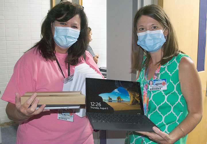 Marjorie Dean, left, and Bethany Files were among the first to receive their new Surface Pros. 