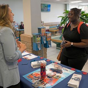 Lauren Boyd, left, transfer admission counselor with the University of Mississippi, talks to Chakiya Smith, MCC sophomore, about the university’s deadlines for admissions. 