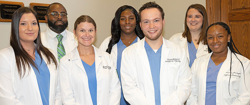 At the Surgical Technology Program pinning ceremony are, back from left, Paul Ford, Surgical Technology Program coordinator, Myra Boler, and Alex Tarpley. Front from left are Sara Scales, Jessica Walley, Chandler Stovall and Tenesha Pringle.