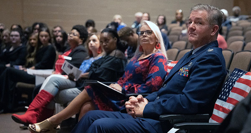 Col. Albert Germany, right, listens as a musical tribute to veterans was played during MCC’s Veterans Day program.  